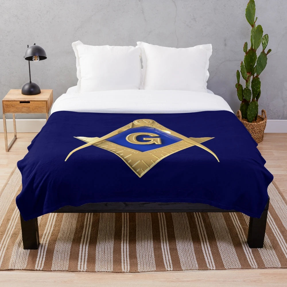Freemason-inspired blue and gold plush blanket with square and compass masonic symbol