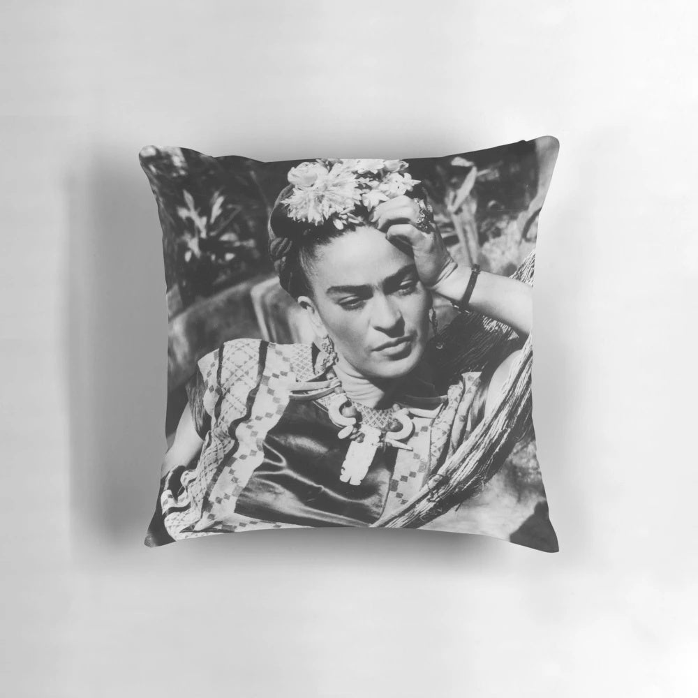Decorative pillow featuring a portrait of Frida Kahlo, the renowned Mexican artist.