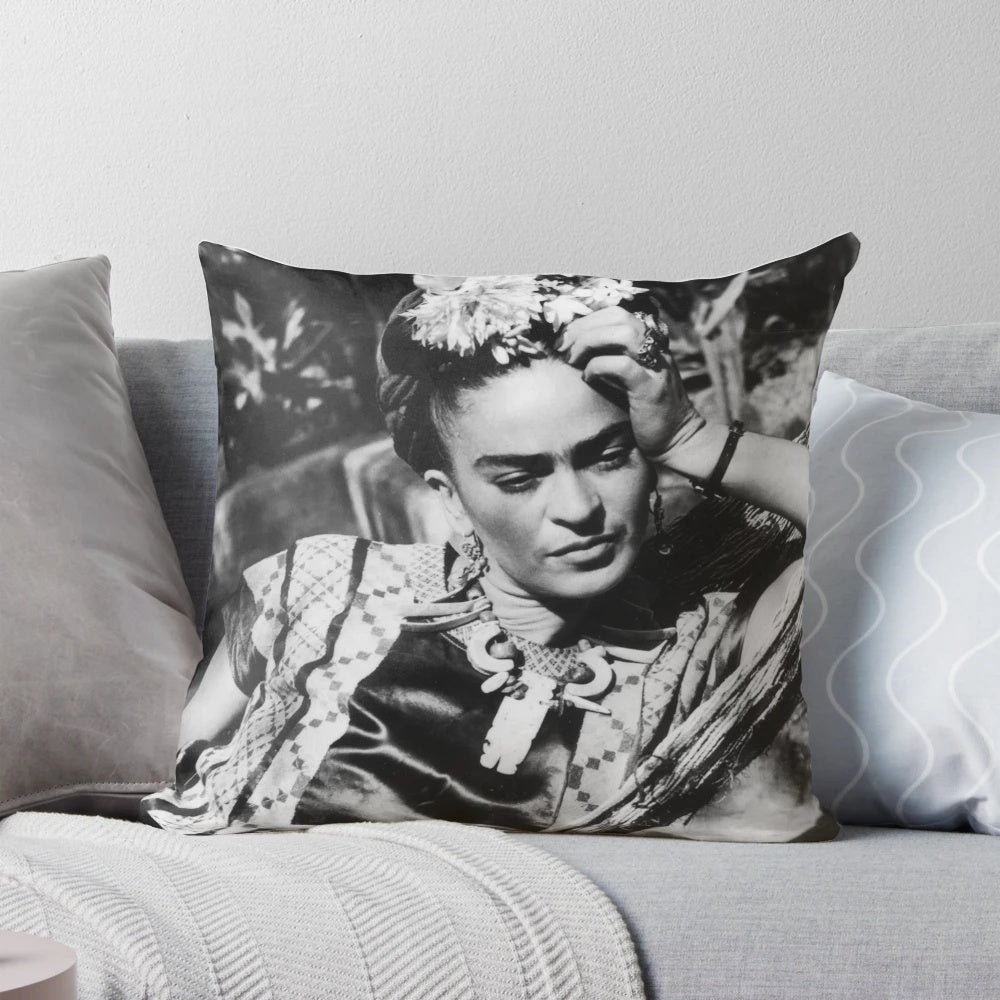 Decorative pillow featuring a portrait of Frida Kahlo, the renowned Mexican artist.