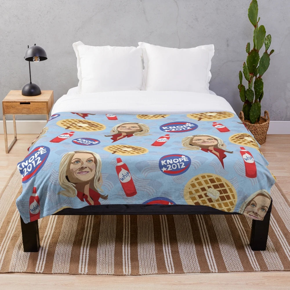 Friends, Waffles, and Work" themed plush blanket featuring beloved Parks and Recreation characters