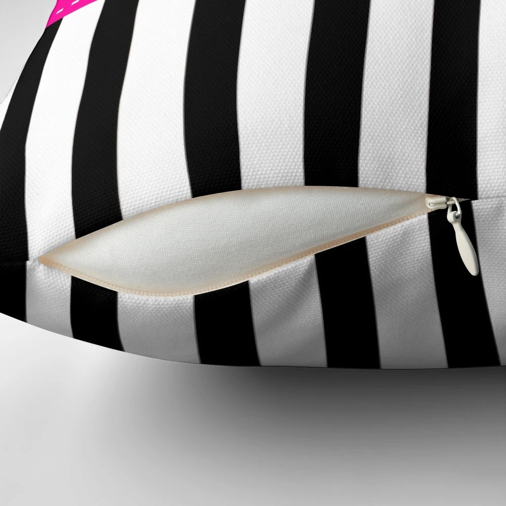 Fuchsia, black, and white striped decorative pillow