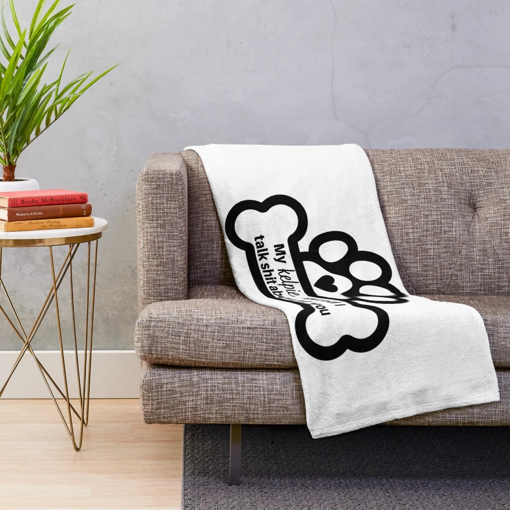 Australian Kelpie dog on a plush blanket