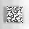 Throw pillow with a hand-drawn pattern of black and white cats knocking things over, a humorous design for cat lovers.