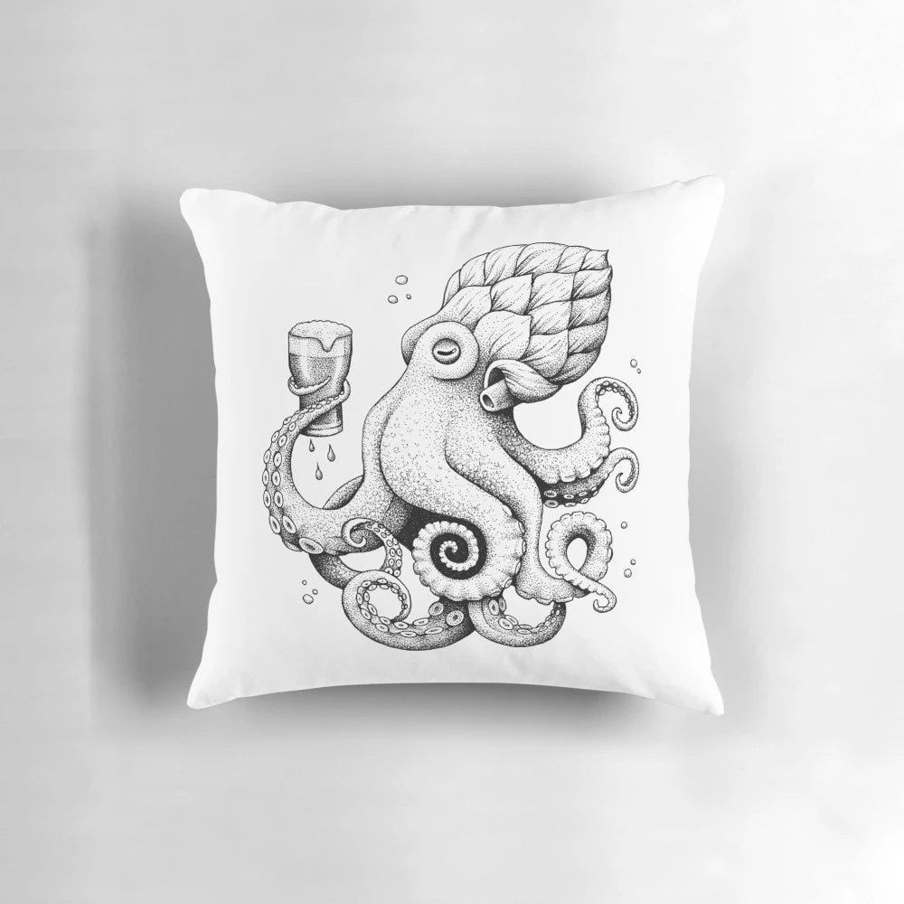 A black and white cartoon illustration of an octopus drinking a beer on a plush pillow