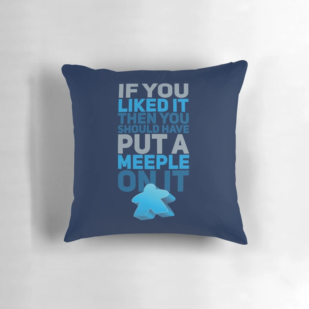 A decorative pillow featuring a funny "Should Have Put a Meeple On It" design, perfect for board game enthusiasts.