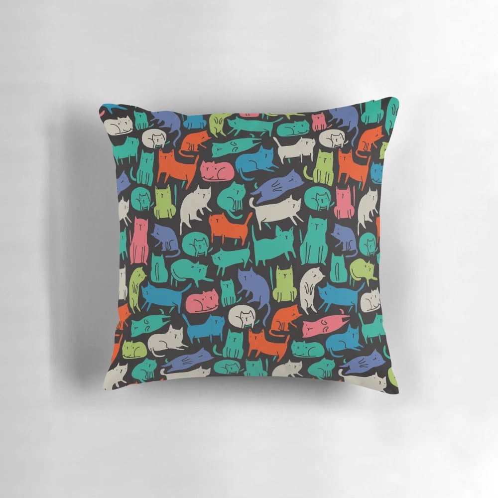 Vibrant and whimsical pillow featuring a playful design of colorful cartoon cats.