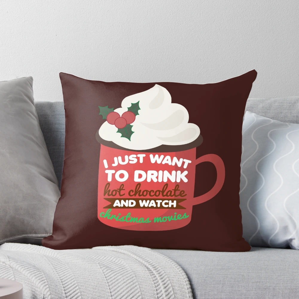 Funny Christmas pillow with a hand-drawn design of a person drinking hot chocolate while watching holiday movies.