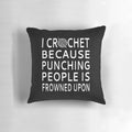 Crochet-themed throw pillow with funny "I Crochet Because Punching People is Frowned Upon" design