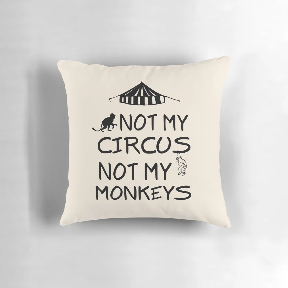 Colorful decorative pillow with the text "Not My Circus, Not My Monkeys" printed on it