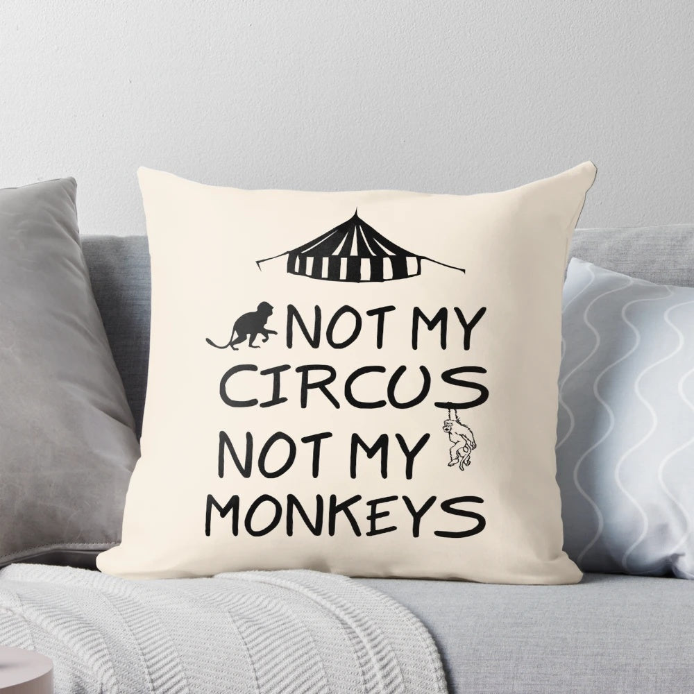 Colorful decorative pillow with the text "Not My Circus, Not My Monkeys" printed on it