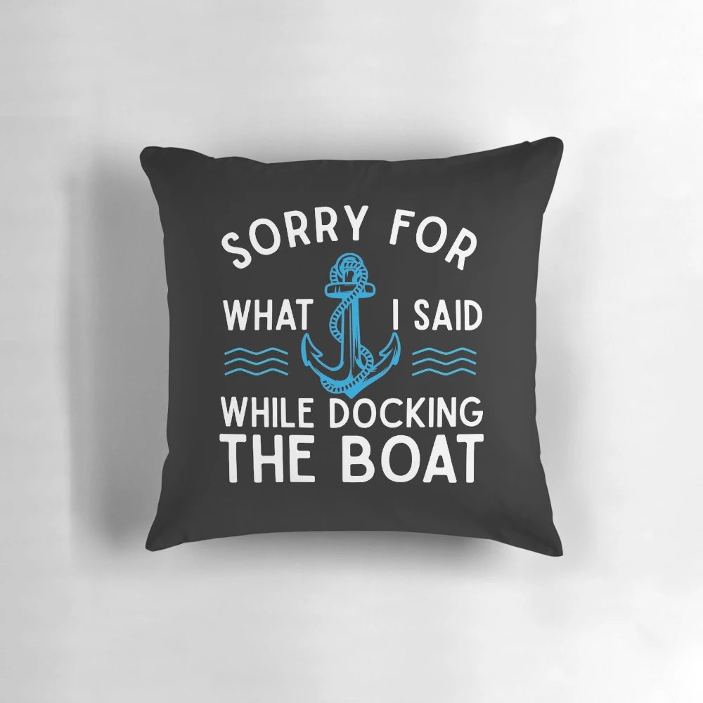 A white pillow with the text "Sorry for what I said while docking the boat" printed on it, a humorous gift for boating and sailing enthusiasts.