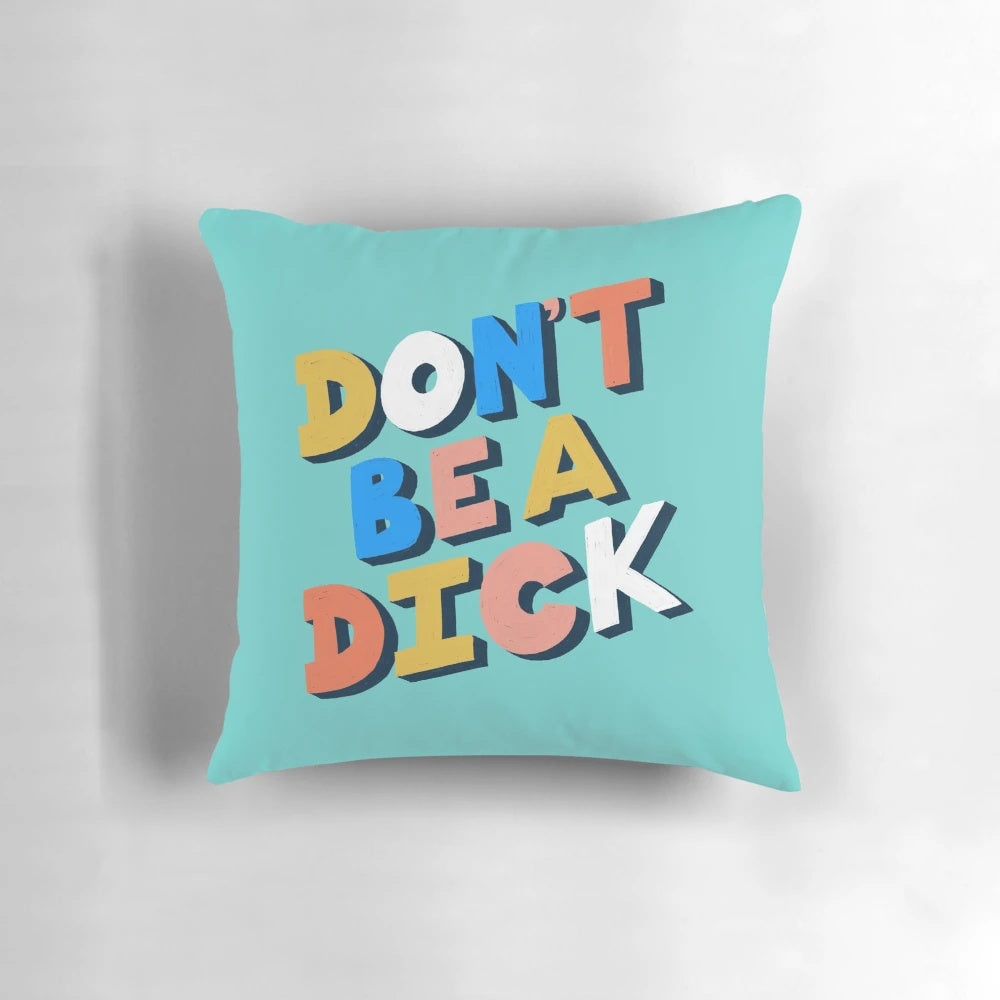 Funny typography pillow with the text "Don't Be A Dick" in a bold, stylized font