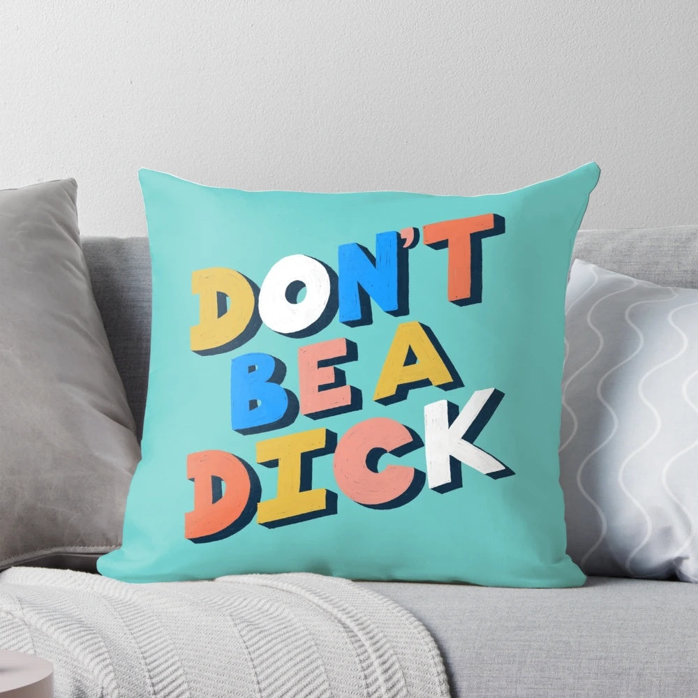Funny typography pillow with the text "Don't Be A Dick" in a bold, stylized font