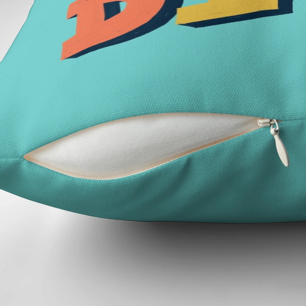 Funny typography pillow with the text "Don't Be A Dick" in a bold, stylized font