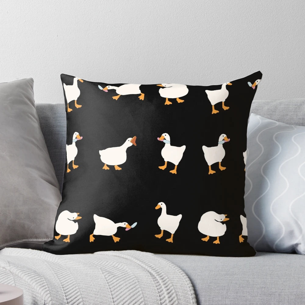 A soft, plush pillow featuring a cute and funny illustration of a duck and goose with knives, inspired by the popular video game Untitled Goose Game.