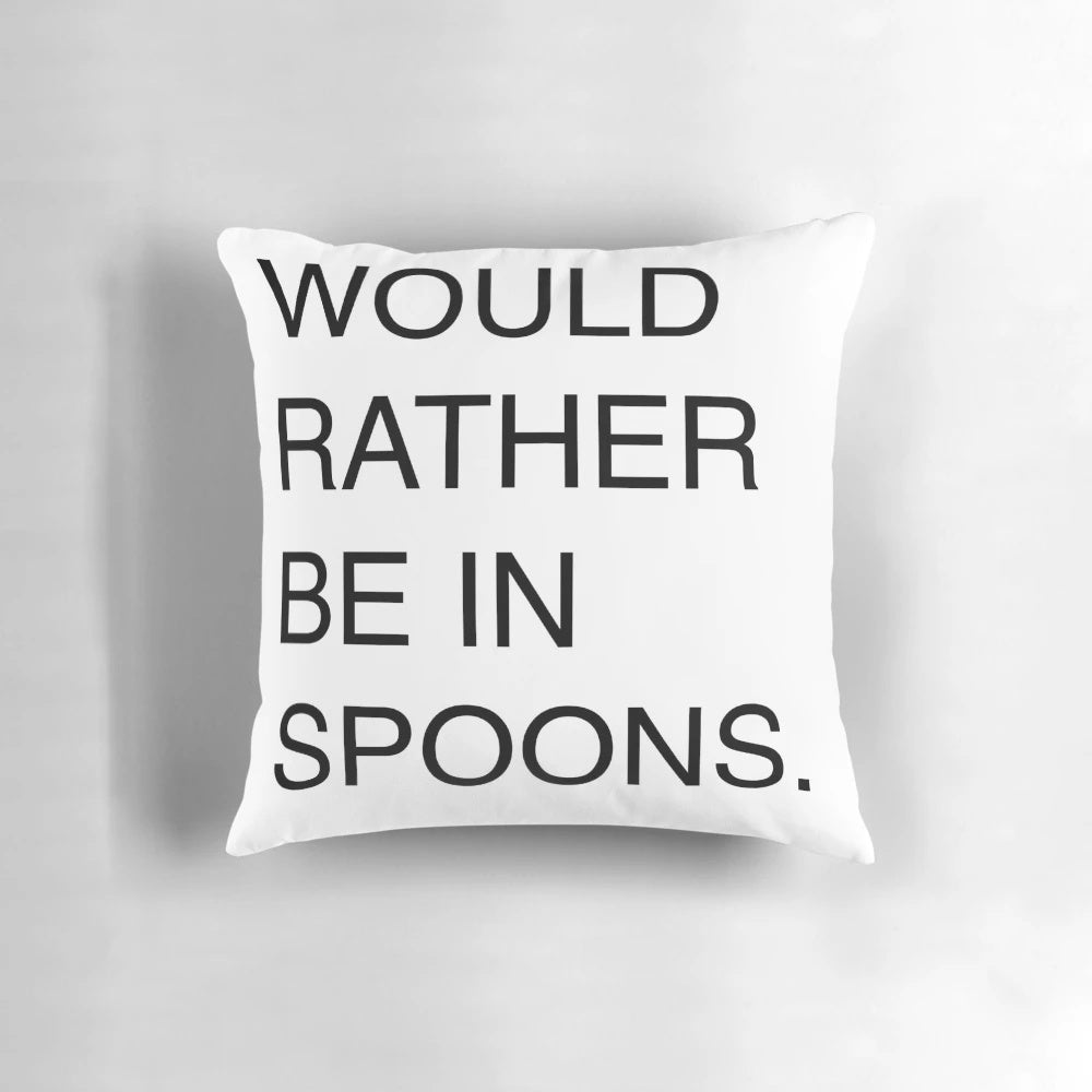 A white pillow with the text 'Would Rather Be In Spoons' printed in a humorous font, referencing the popular UK pub chain Wetherspoons.