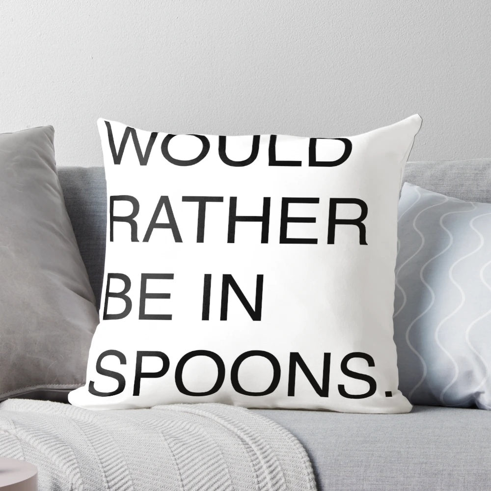 A white pillow with the text 'Would Rather Be In Spoons' printed in a humorous font, referencing the popular UK pub chain Wetherspoons.