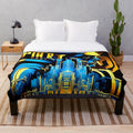 Futuristic cinema-themed plush blanket with color block design in blue, black, yellow, and orange