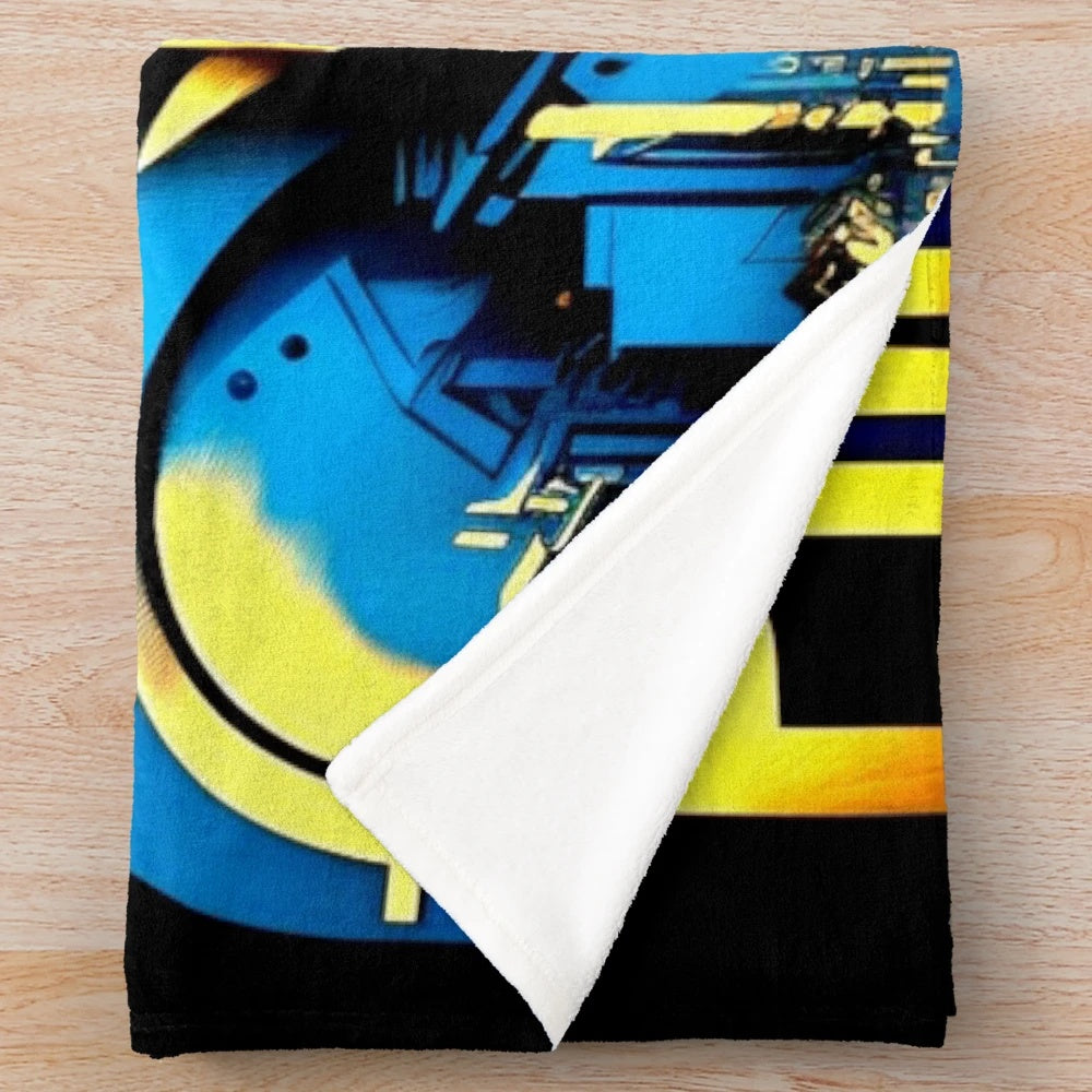 Futuristic cinema-themed plush blanket with color block design in blue, black, yellow, and orange