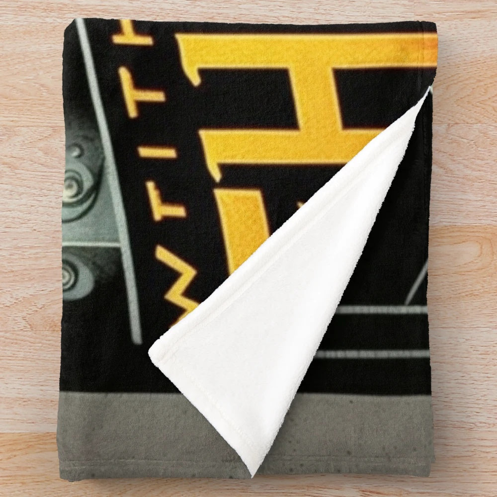 Futuristic cinema-inspired plush blanket with a monochromatic metropolitan design