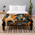 Futuristic cinema-themed plush blanket with abstract gray, black, and orange design