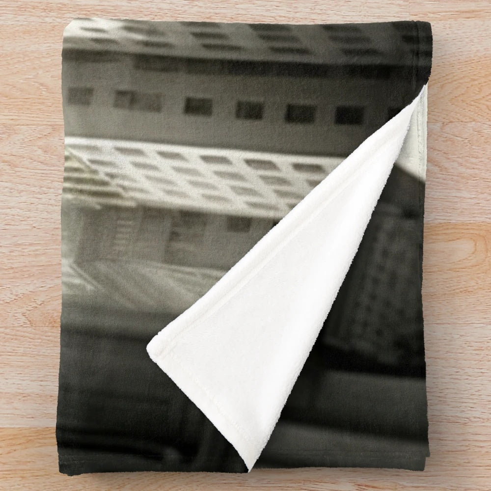 Futuristic plush blanket with cinematic, urban design