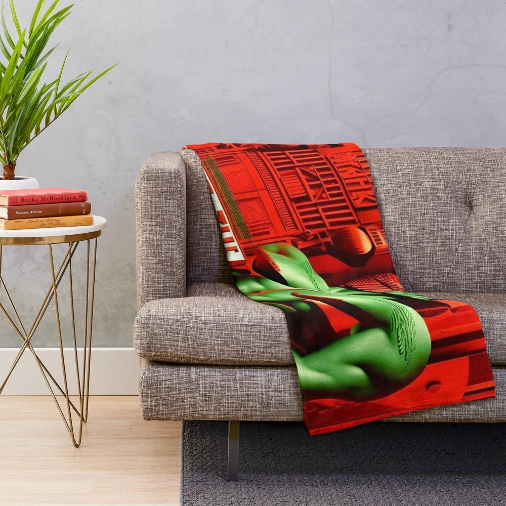 Futuristic city-inspired plush blanket with red, green, black, and white colors
