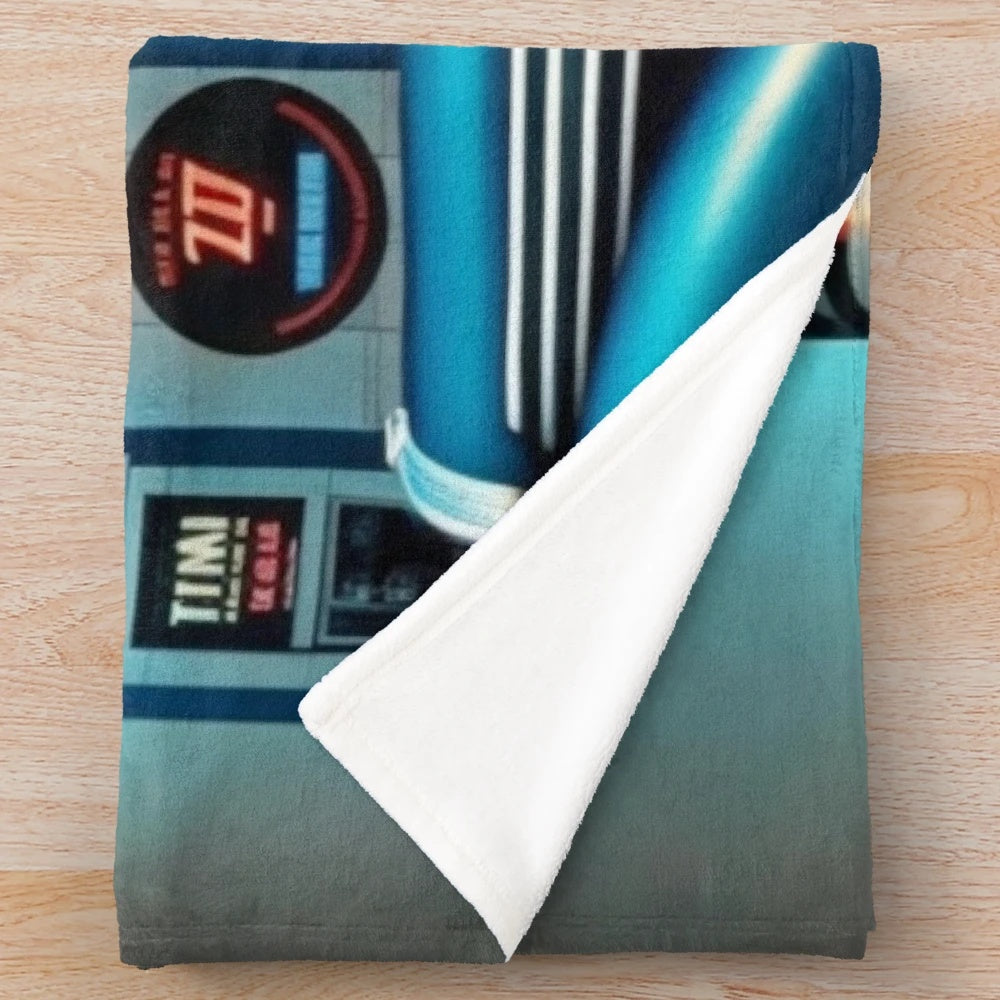 Futuristic city-themed plush blanket with cinema and automotive elements