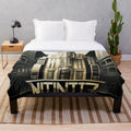 Futuristic cityscape plush blanket with cinema and light game elements
