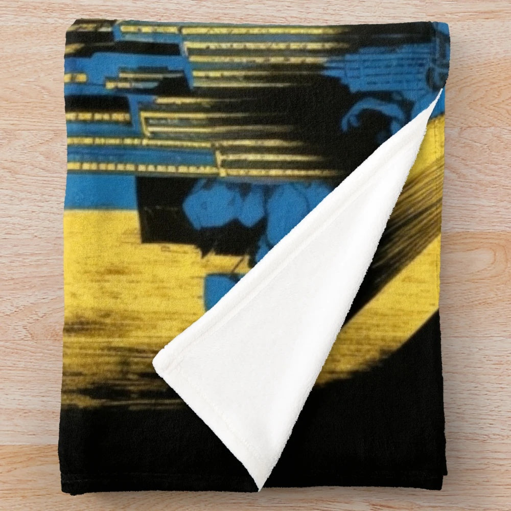 Plush blanket featuring a futuristic Metropolis city movie theater design