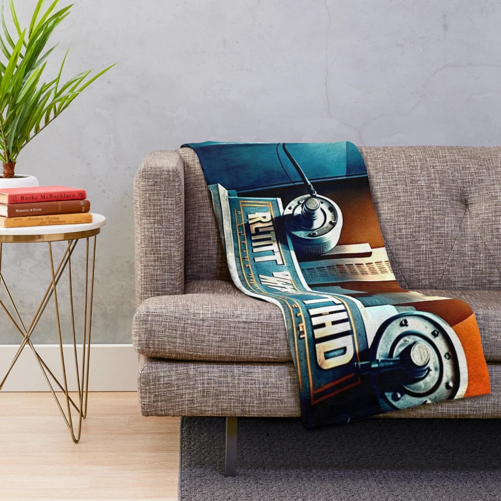 Plush blanket featuring a futuristic, metropolitan cityscape in a color palette of black, blue, white, yellow, and orange