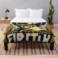 Plush blanket with futuristic movie-inspired cinema lighting and art in yellow, black, and gold colors