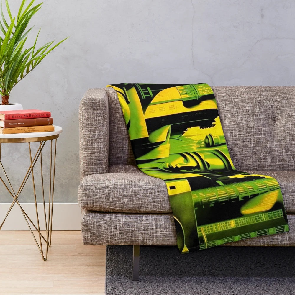 Futuristic city plush blanket with geometric movie theater design in green, black, and yellow