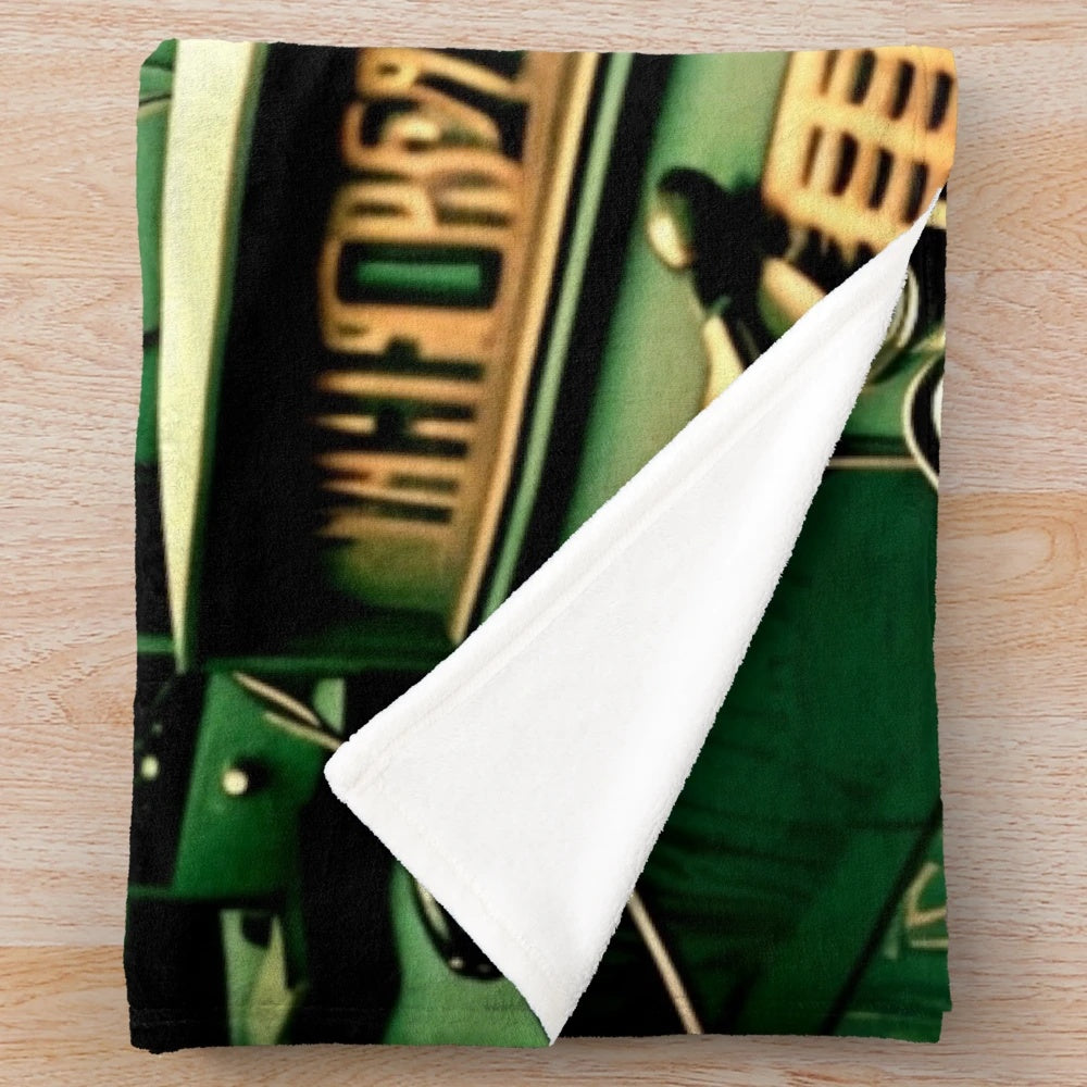 Futuristic plush blanket with cinematic design elements in black, green, white, and beige