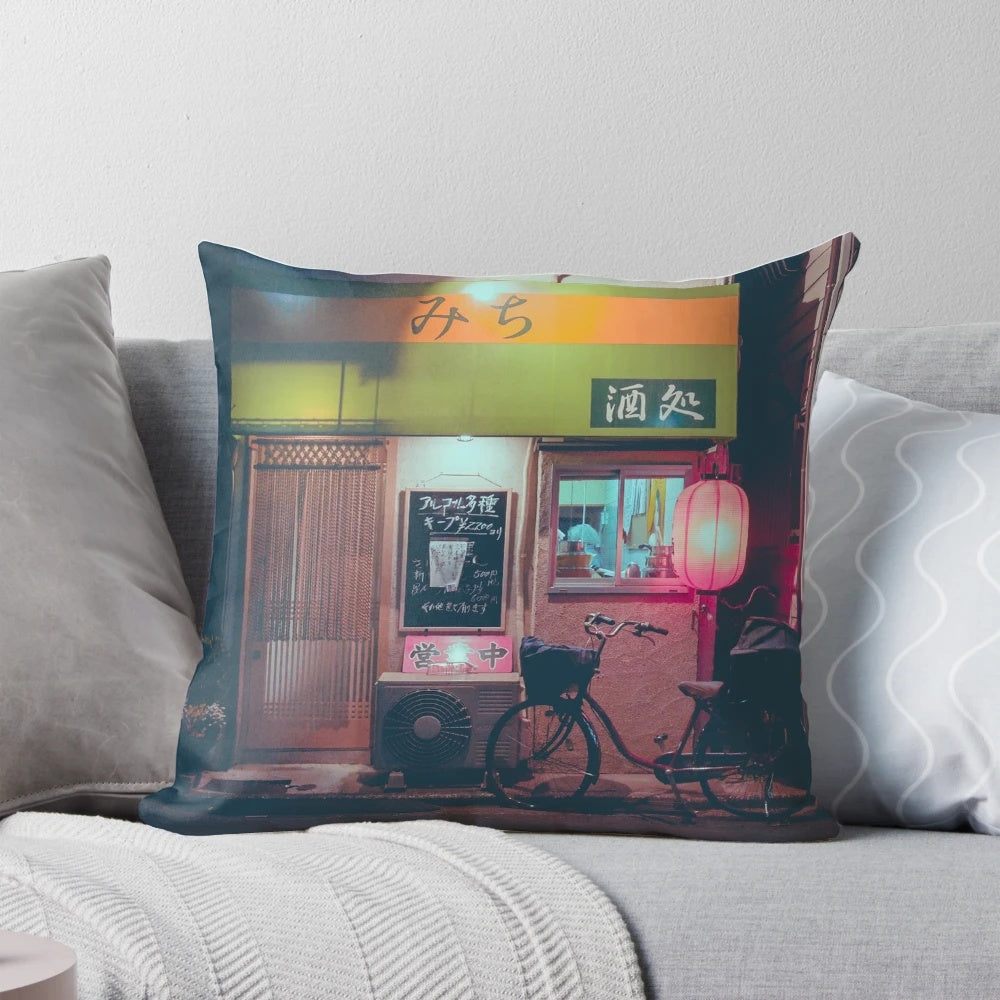A futuristic pillow with a vibrant street scene of a Tokyo ramen alley, featuring neon lights, lanterns, and a bicycle