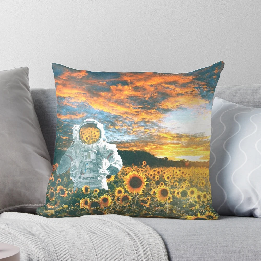 A whimsical pillow featuring a spaceman surrounded by sunflowers, set against a starry night sky.