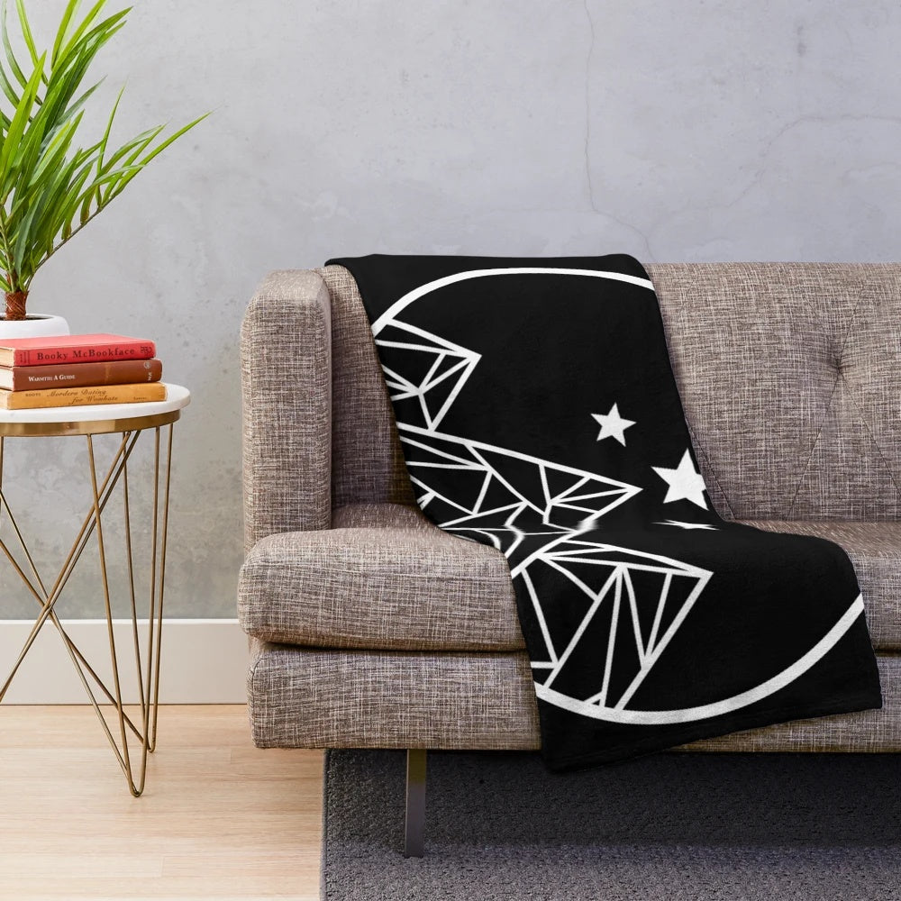 Plush blanket featuring a white outline design of mountains and stars against a galaxy background