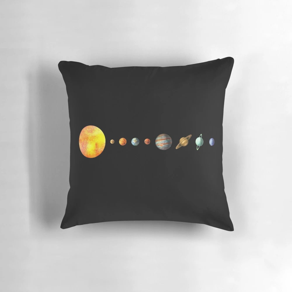 Vibrant digital illustration of the solar system planets on a soft, plush throw pillow.
