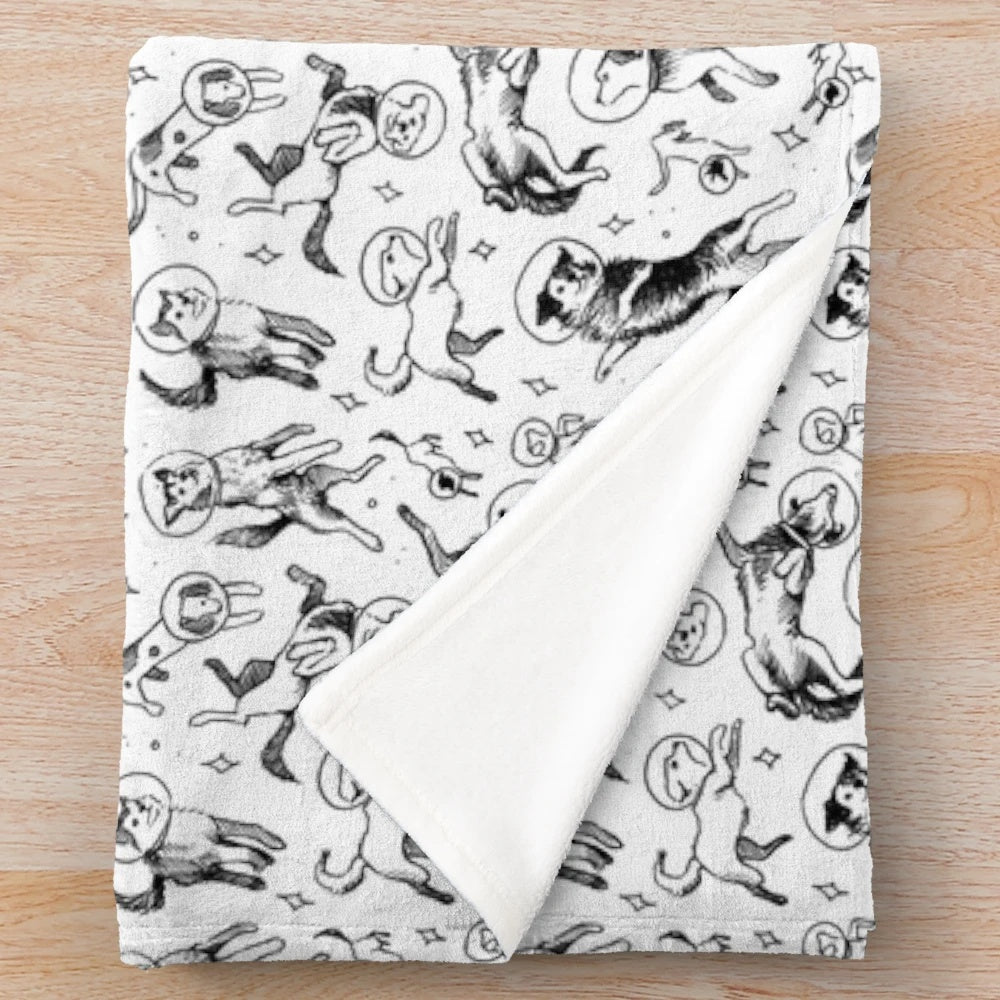 Plush blanket featuring a cosmic dog design