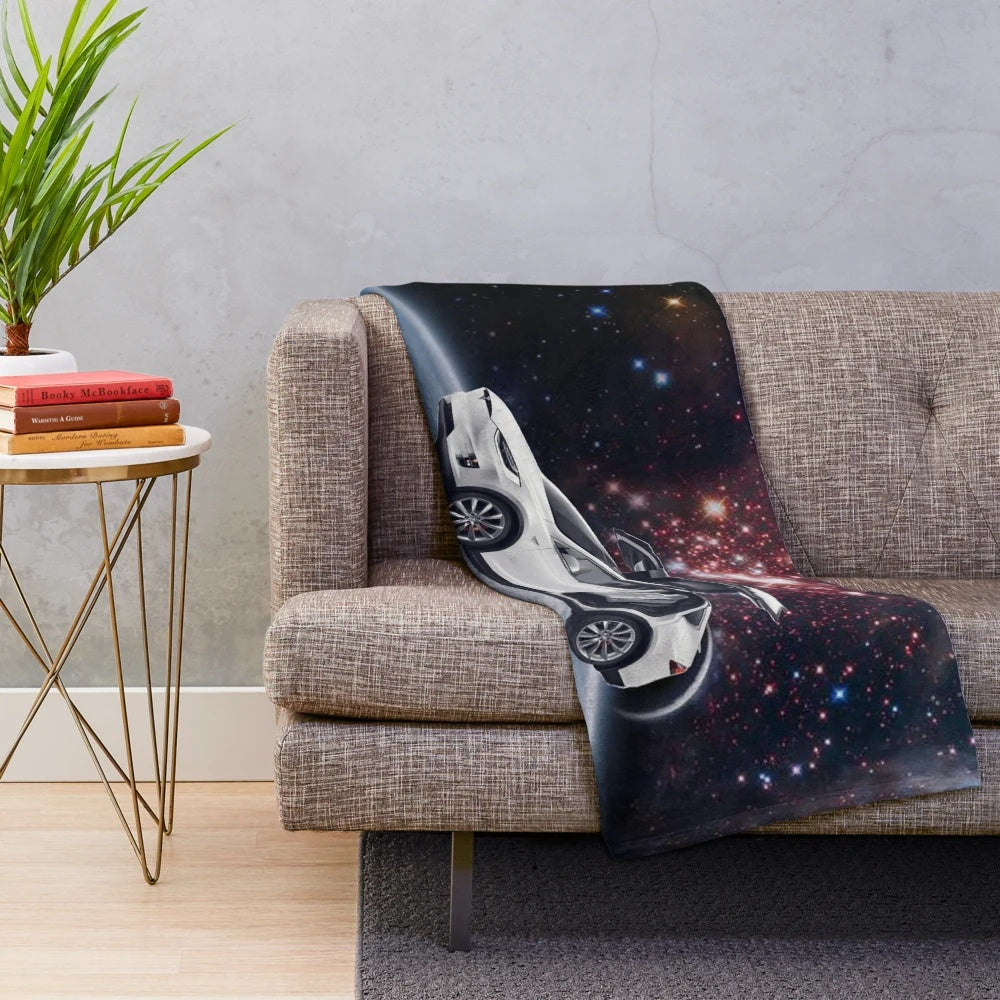Plush galaxy-themed blanket with Tesla car design
