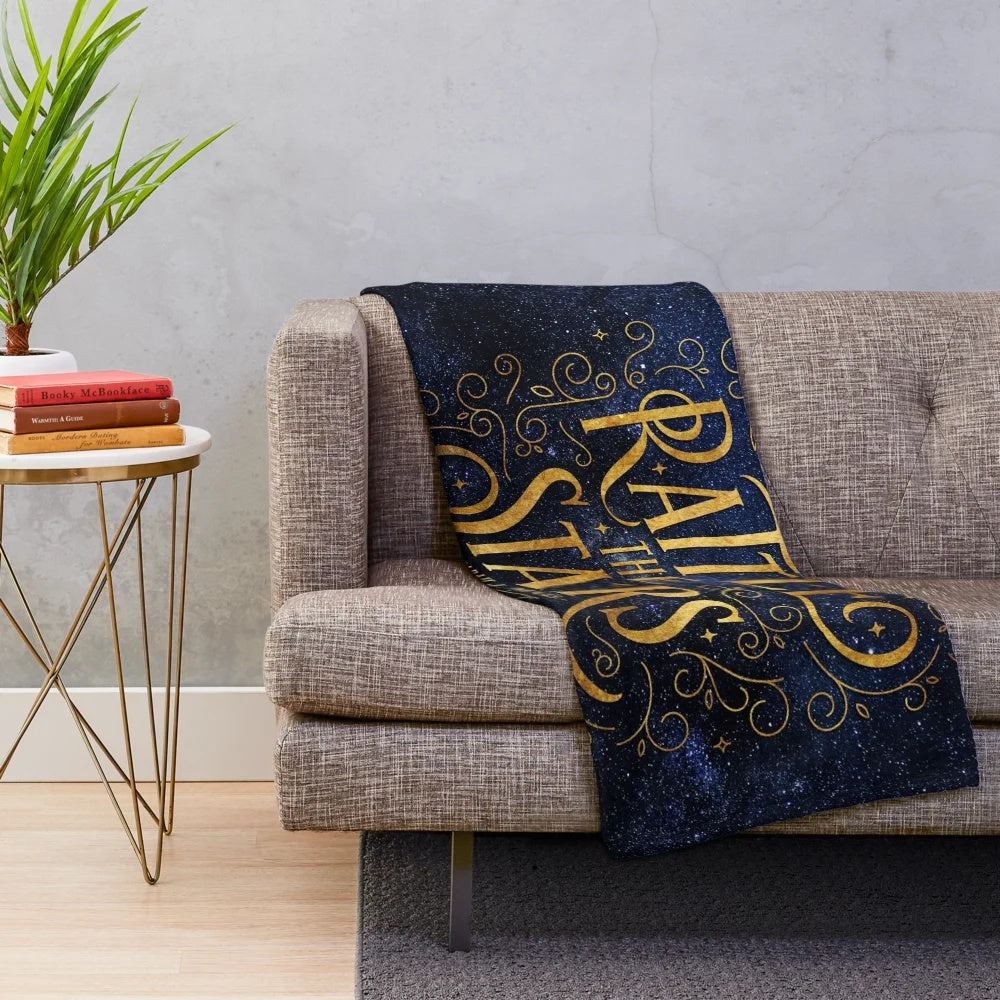 Galaxy-inspired plush blanket with starry night sky design