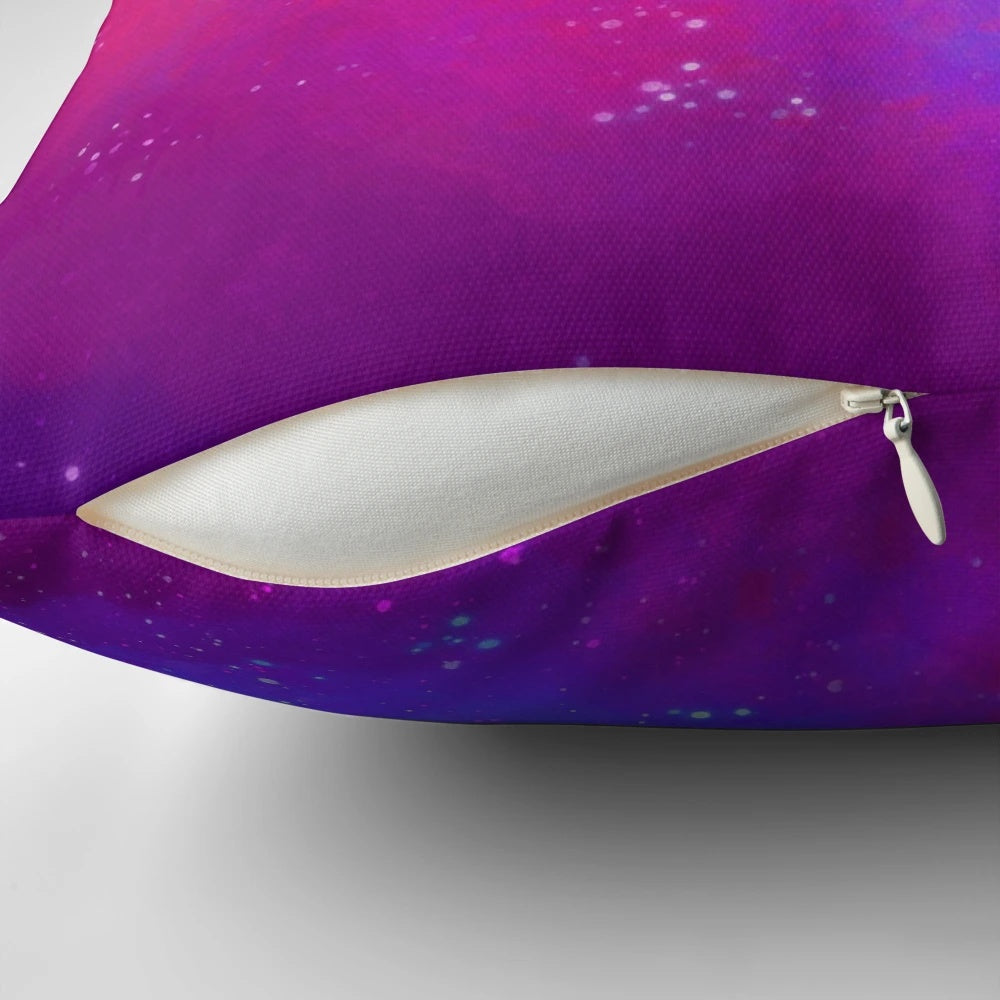 Colorful galaxy-themed pillow with a spray paint sky design