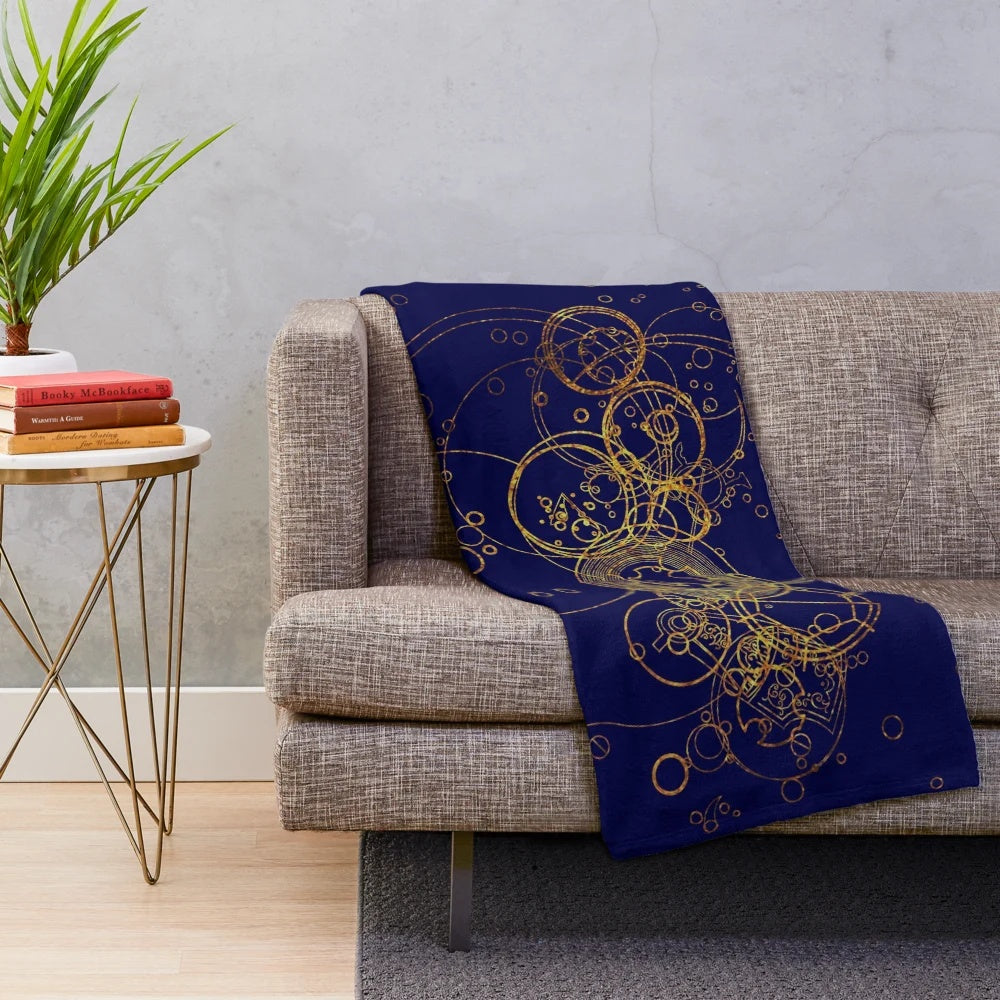 Transparent and glittery plush blanket with a time lord, tardis, and gallifreyan inspired pattern