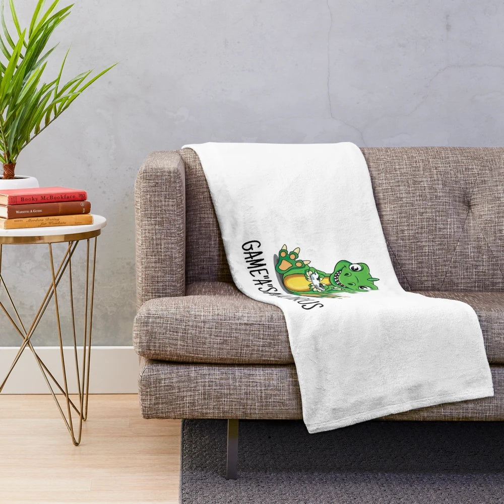 Gamer-inspired dinosaur plush blanket with game controller design