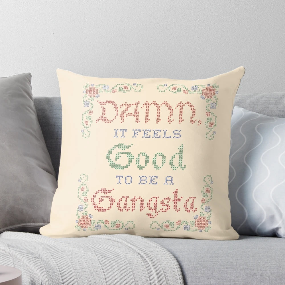 Pillow featuring the iconic 'Damn It Feels Good to Be a Gangsta' lyrics from the movie Office Space