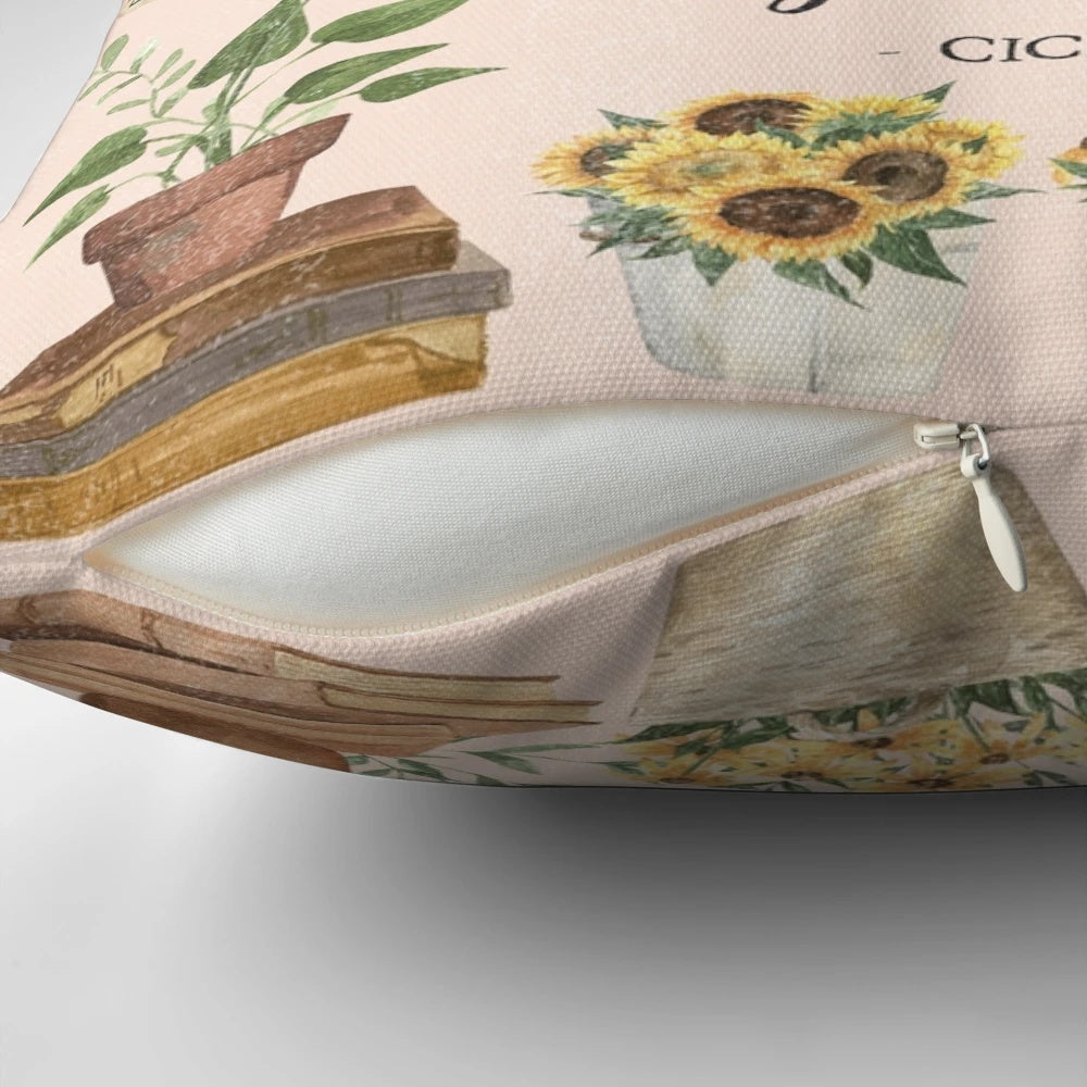 A decorative throw pillow featuring a quote surrounded by illustrations of herbs, sunflowers, and an open book.