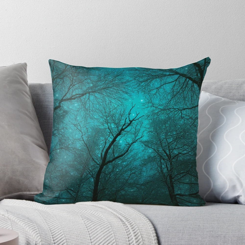 Pillow featuring a design of a starry night sky with silhouetted tree branches