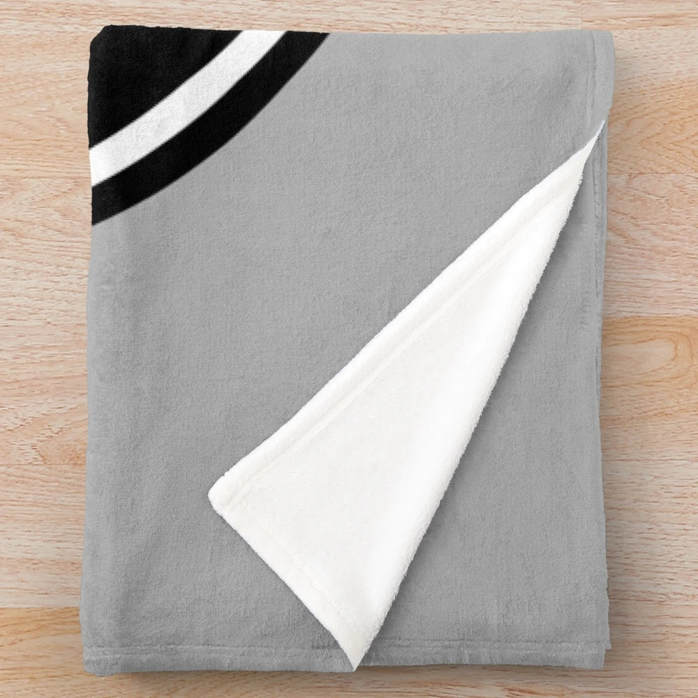 Plush blanket featuring a red manual transmission logo