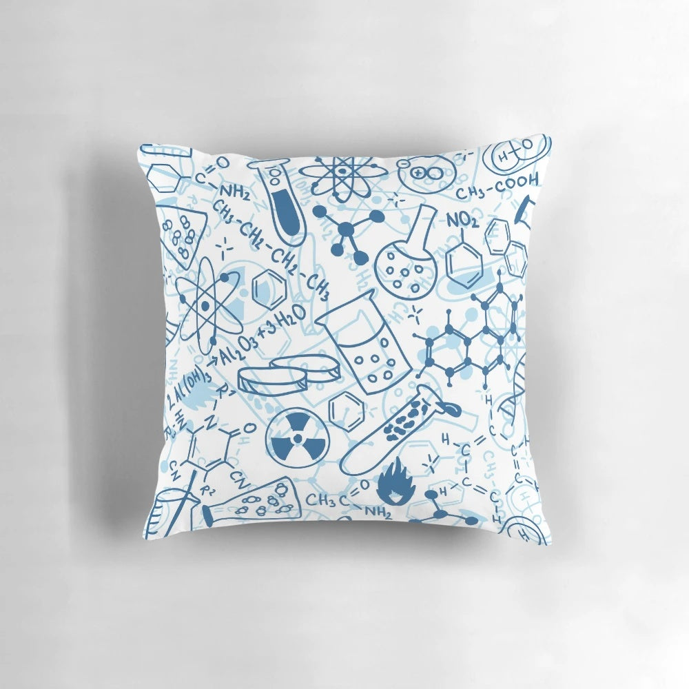 Colorful chemistry-themed pillow with scientific elements like beakers, test tubes, and atoms