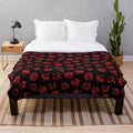 Soft, cozy plush blanket featuring a repeating pattern of d20 dice, perfect for Dungeons and Dragons and other tabletop role-playing game enthusiasts.